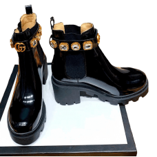 Lacquered boots with stones